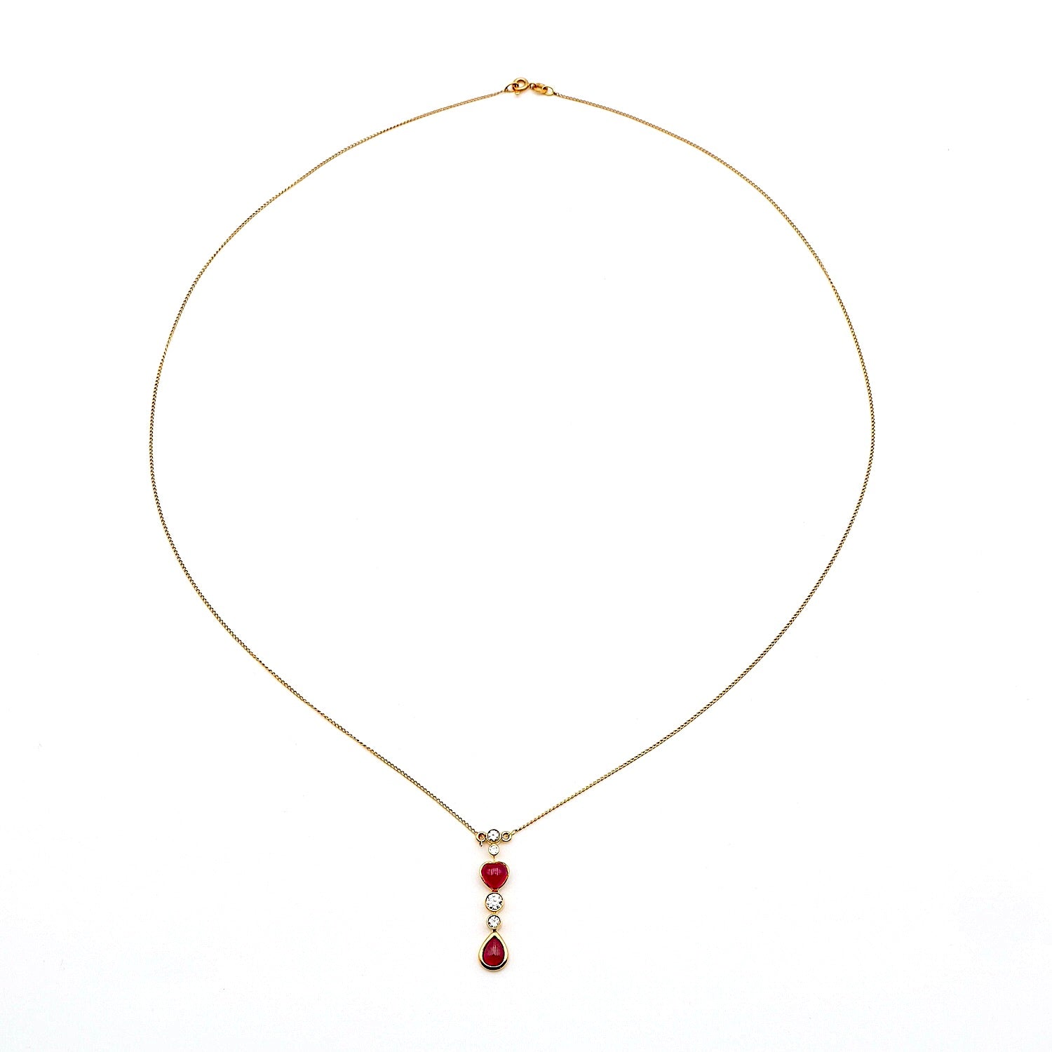 Collier in 750er Gelbgold mit Rubinen und Brillanten, liegend Draufsicht