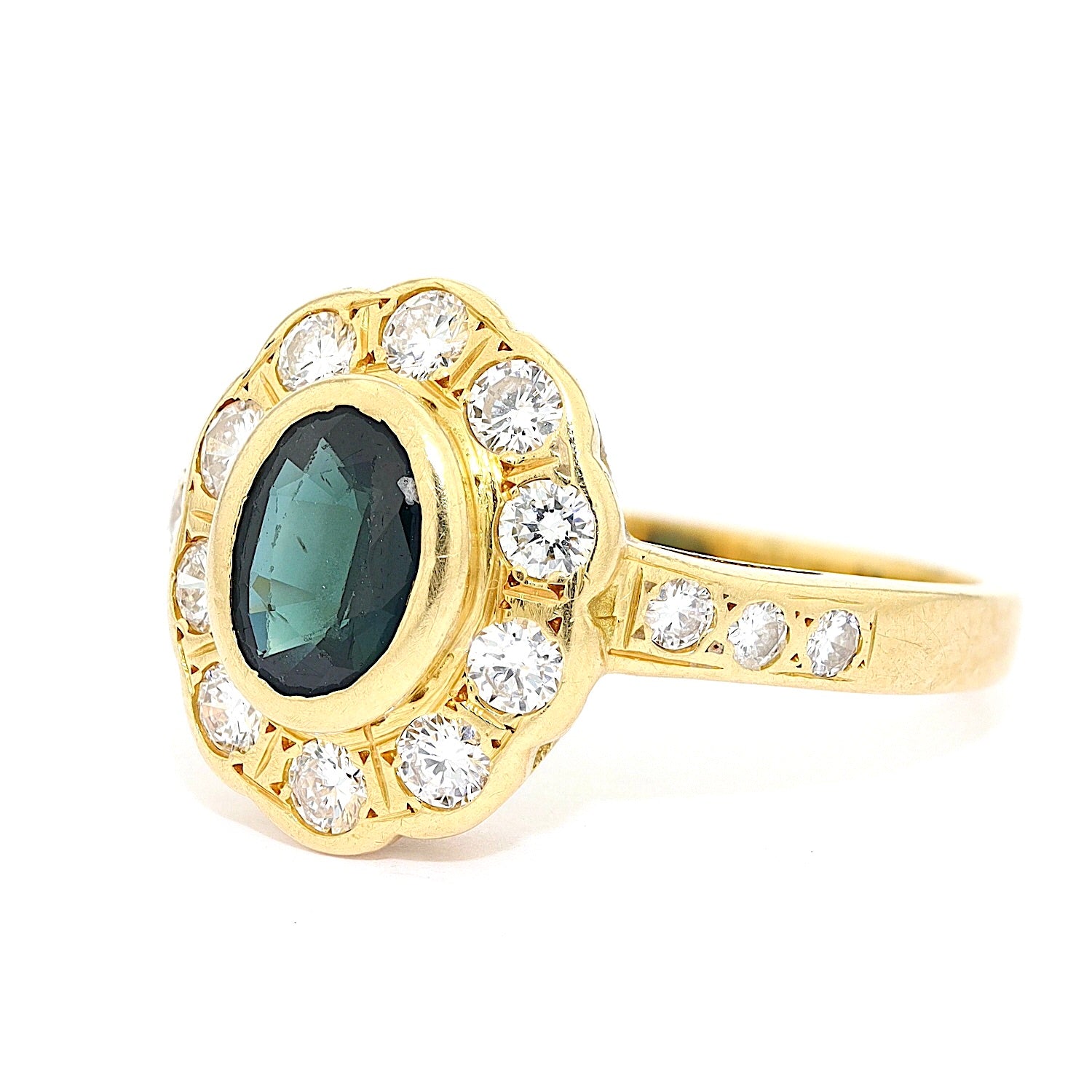 Vintage Ring in 750er Gelbgold mit einem Saphir und Brillanten, liegend links gedreht
