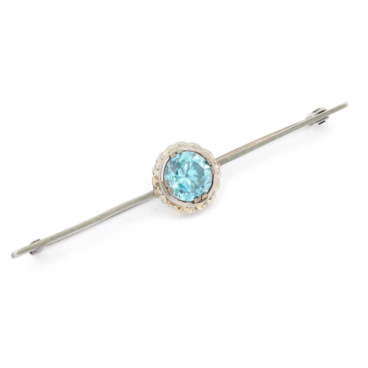 Nadel aus Metall, Gold,Platin und ein natürlicher Zirkon, liegend rechts gedreht