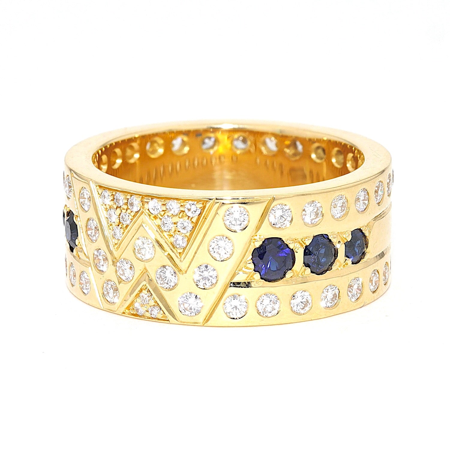 Ring in 750er Gelbgold mit Brillanten und Saphiren, liegend links gedreht