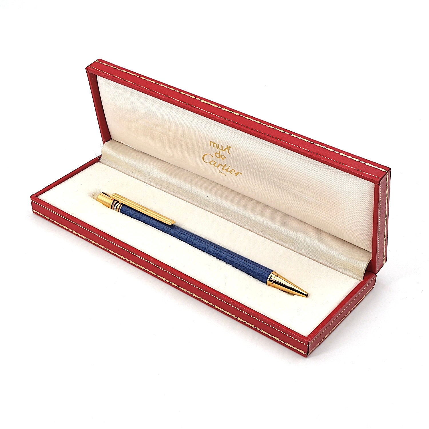 Kugelschreiber mit Drehmechanik von Cartier, Must de Cartier Trinity, liegend in Schatulle