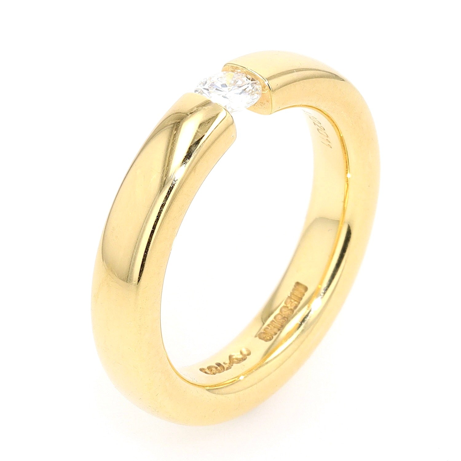 Niessing Spannring in 750er Gelbgold mit einem Brillanten ca. 0,20 ct, stehend