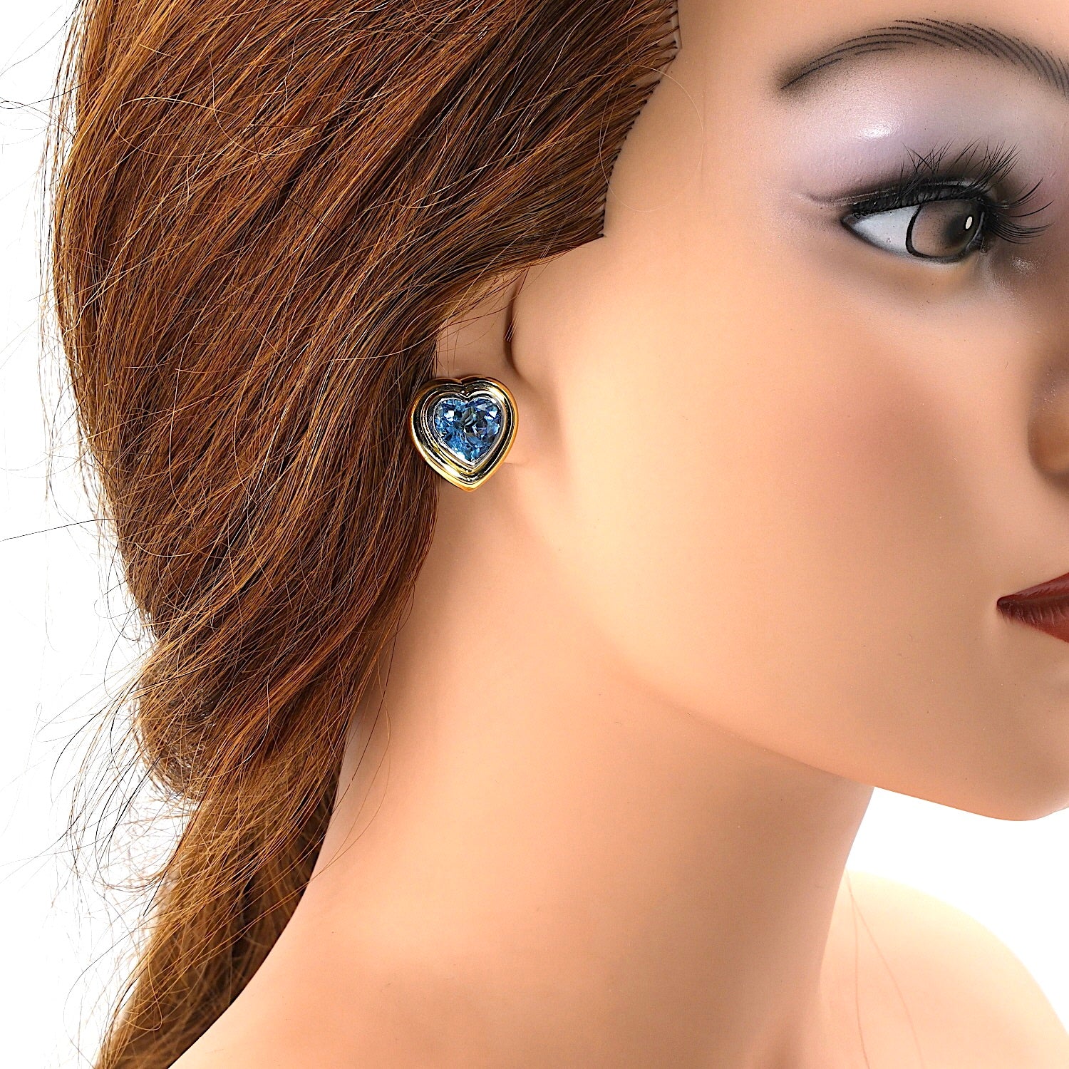1 Paar Ohrstecker in 585er Bicolor Gold mit je einem blauen Topas, einzelnd am Ohr