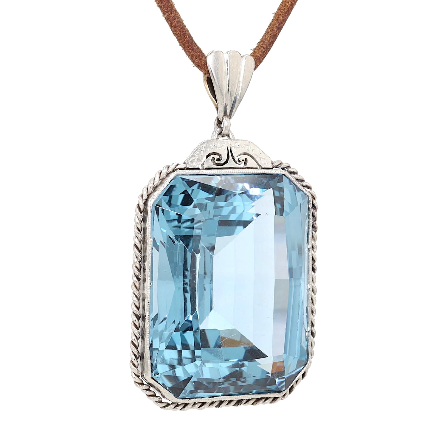 Anhänger in 585er Gelbgold und Platin mit einem großen blauen synthetischen Spinell, hängend rechts gedreht