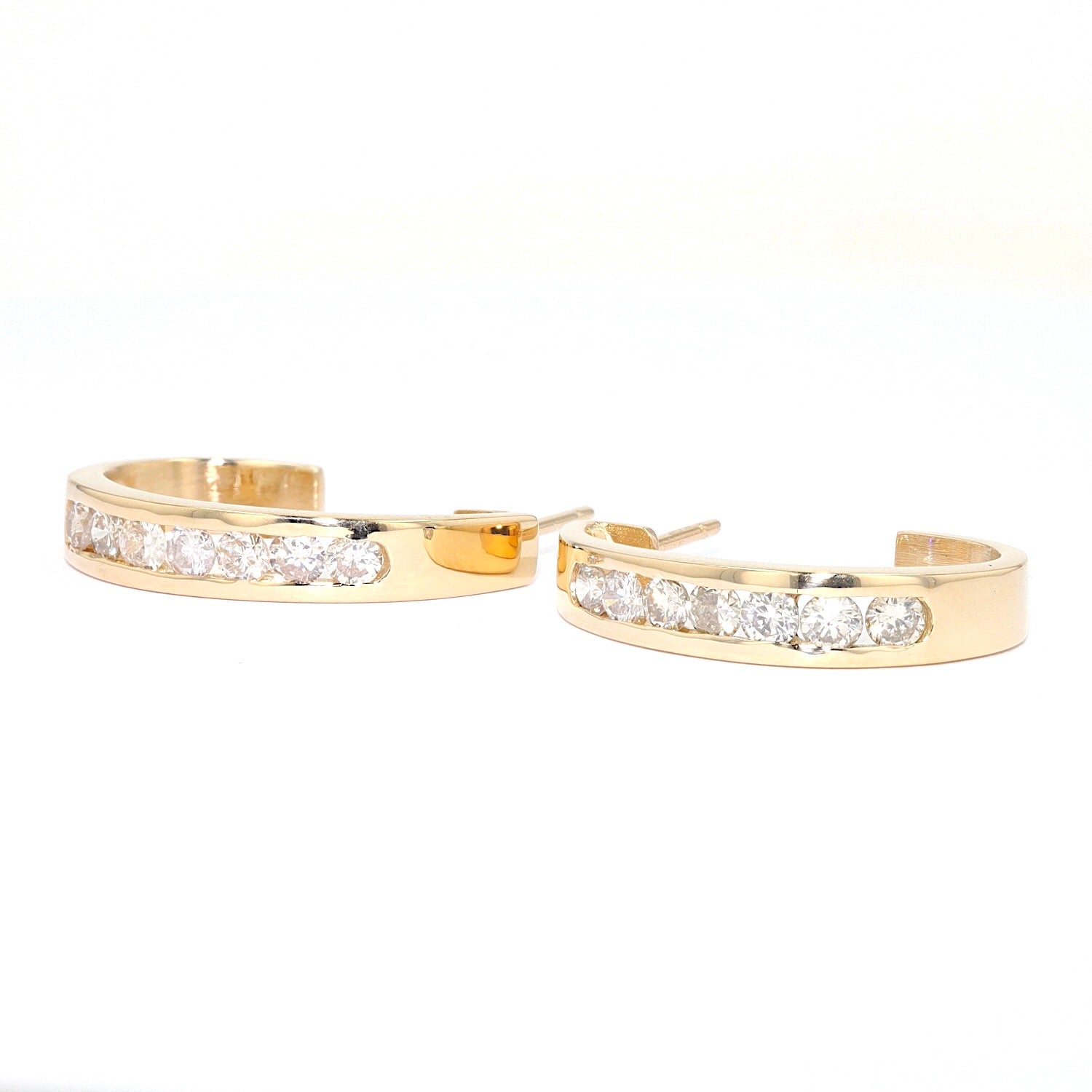 1 Paar Halbkreolen in 585er Gelbgold mit ca. 1 ct Brillanten, liegend links gedreht