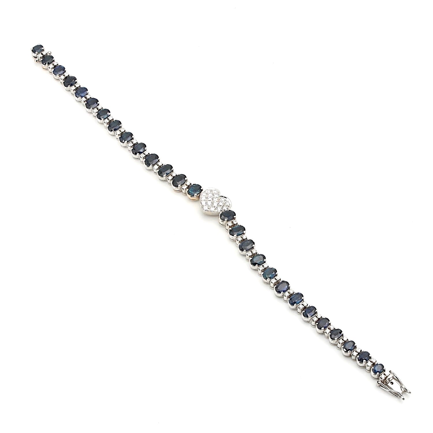 Armband in 750er und 585er Weißgold mit insgesamt ca. 1,3 ct Brillanten und ca. 10,5 ct. blauen Saphiren, liegend lang