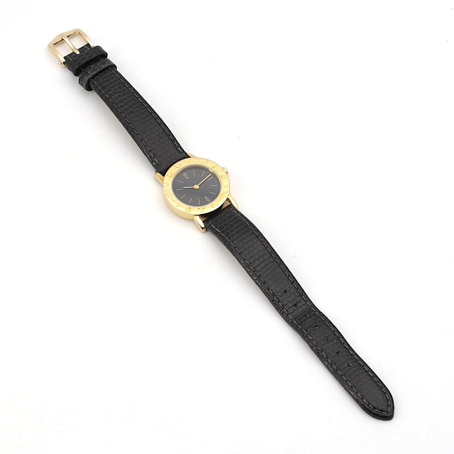 Armbanduhr von Bulgari in 750er Gelbgold mit einem Lederband, liegend flach Draufsicht