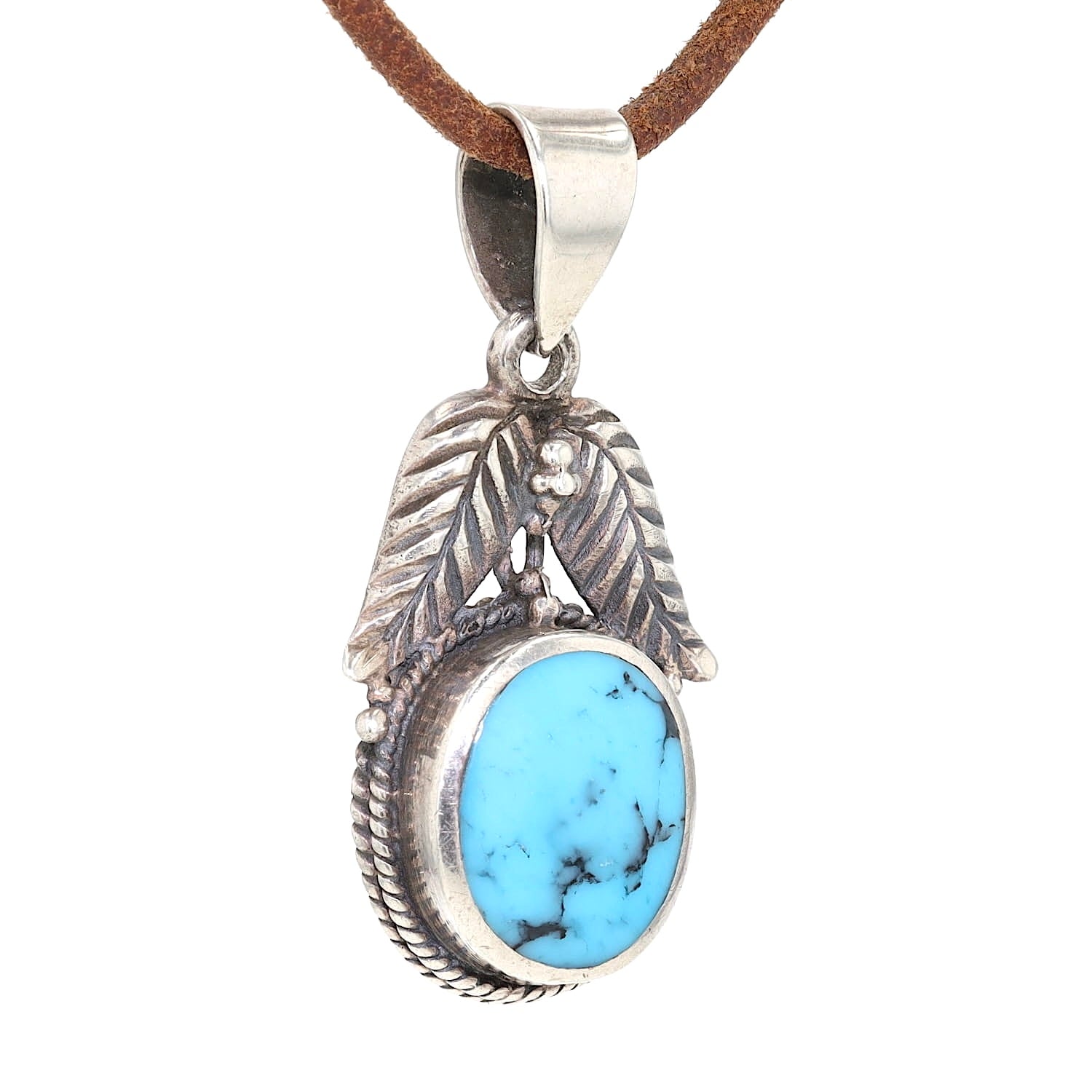 Pendant made of 925 silver with a turquoise imitation, hanging on a brown leather cord slightly turned to the right