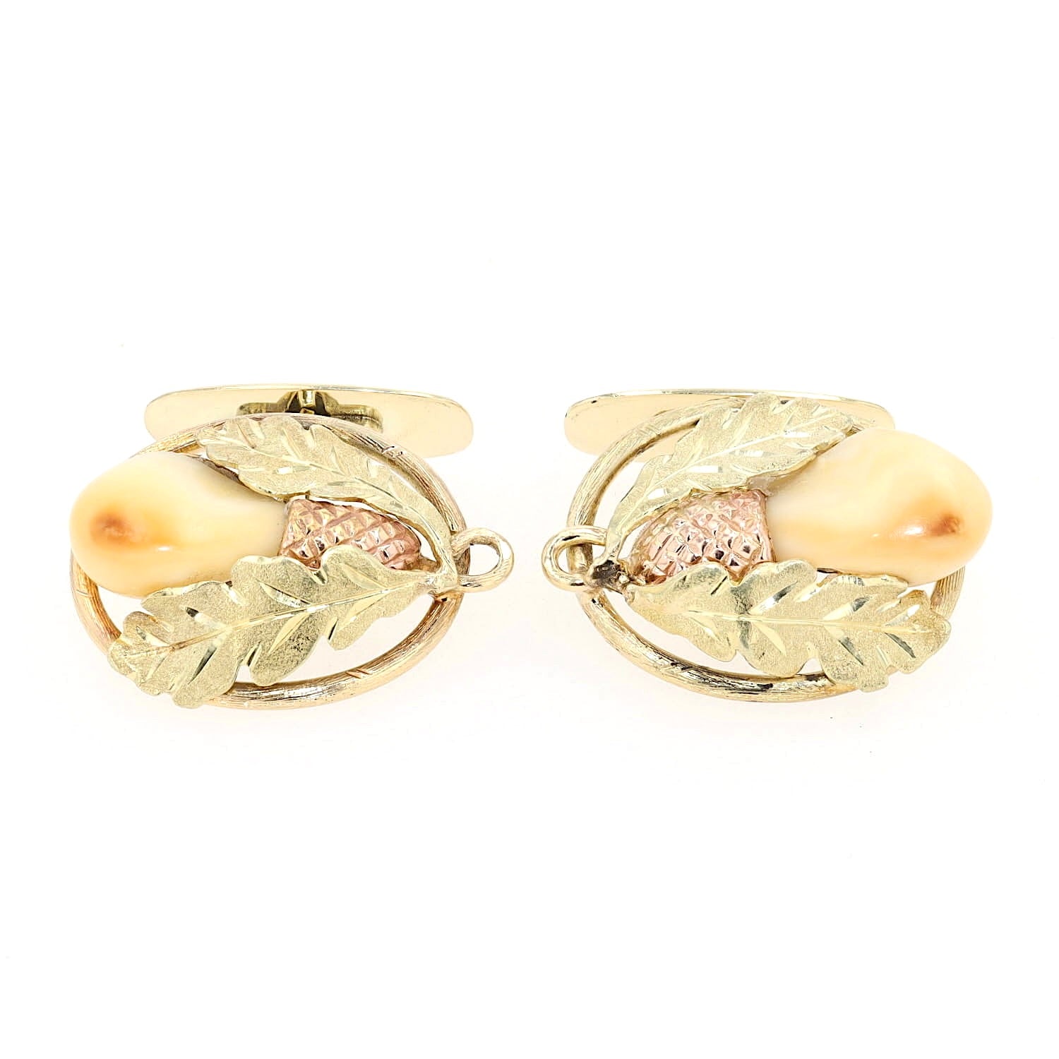 Manschettenknöpfe in 585er Gelbgold-Rotgold mit je einer Grandeln, liegend frontal