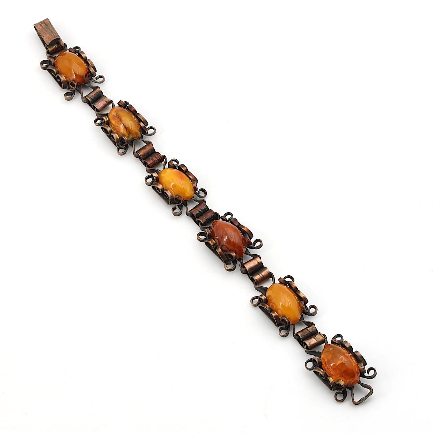 Bracelet made of copper with amber, lying long