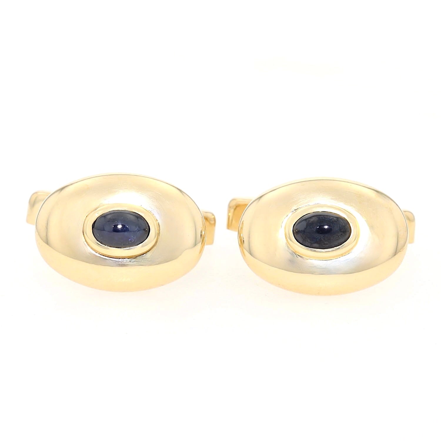 Pair of cufflinks from Quinn in 585 yellow gold, each with a sapphire cabochon, lying frontally