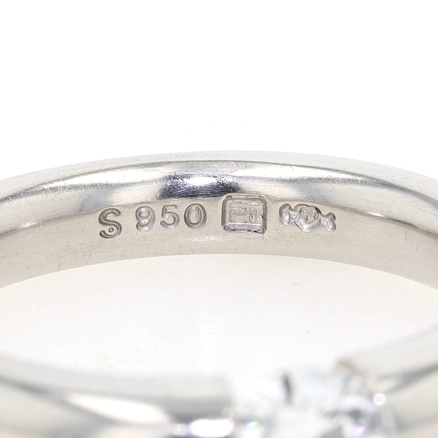 Niessing Spannring in 950er Platin mit einem Brillanten, ca. 0,50 ct , Punzierungen