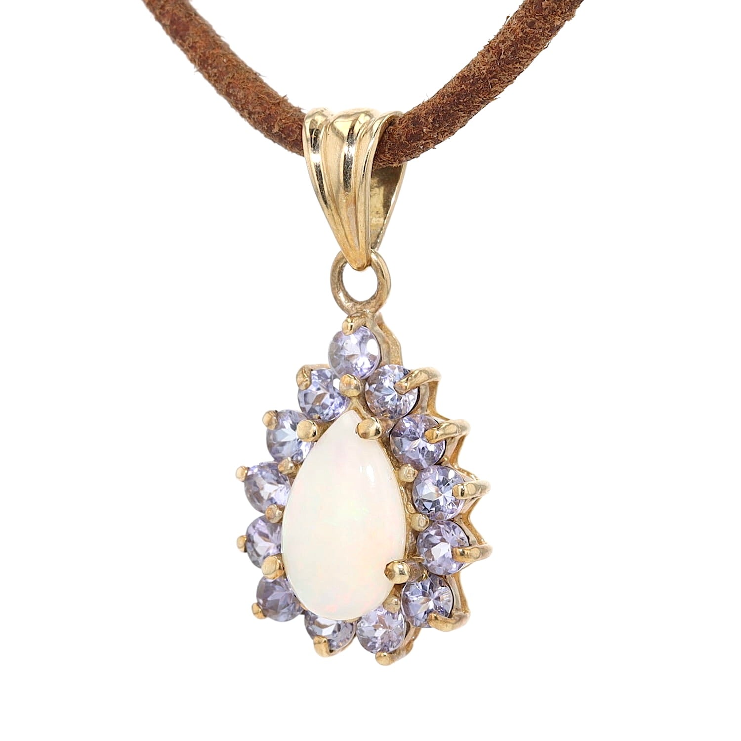 Anhänger in 375er Gelbgold mit einem Opal und Tansaniten, hängend links gedreht