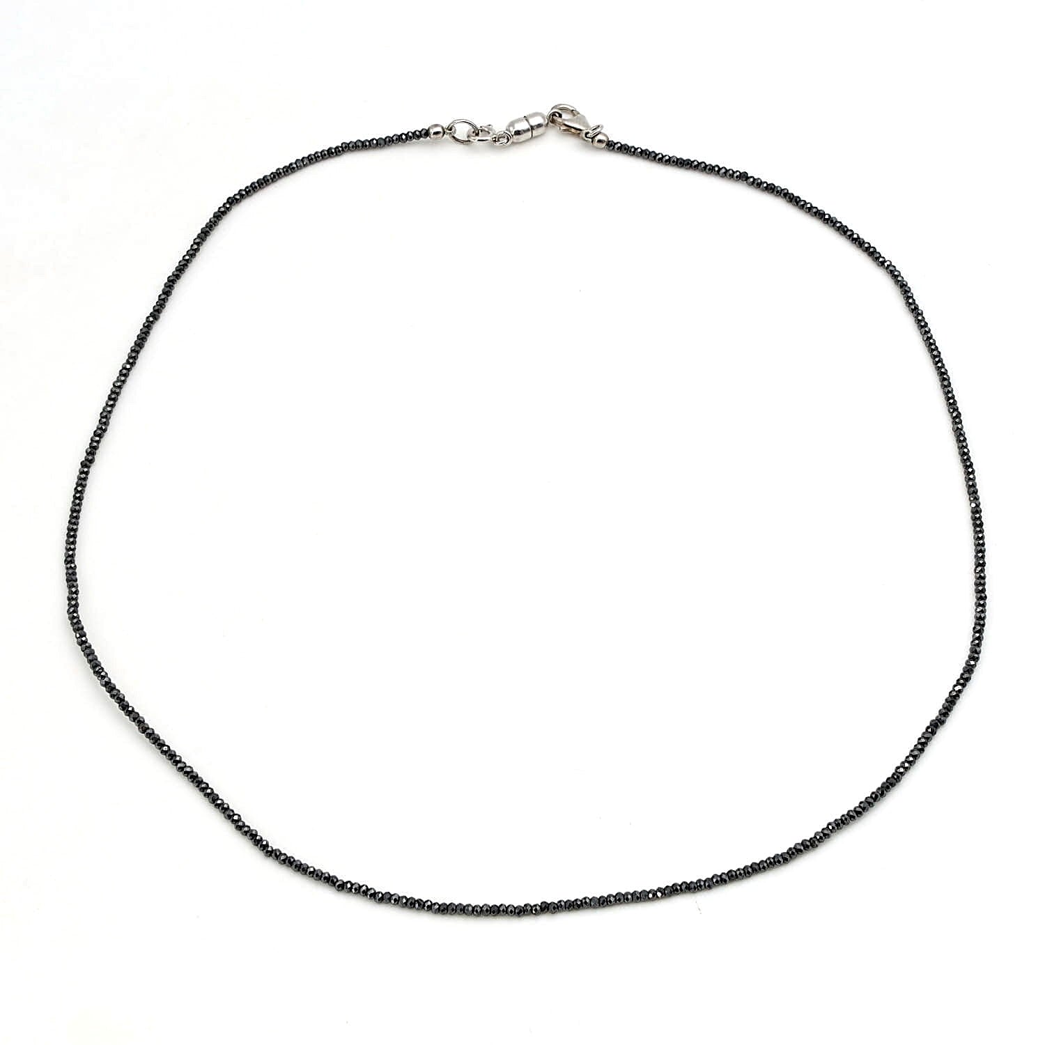 Gemstone necklace made of faceted hematite with a lock made of 925 silver and magnetic lock, closed horizontally