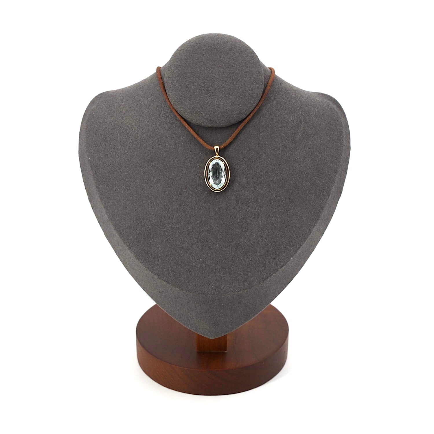 Anhänger in 585er Gelbgold mit einem Aquamarin, an einer dunklen Büste