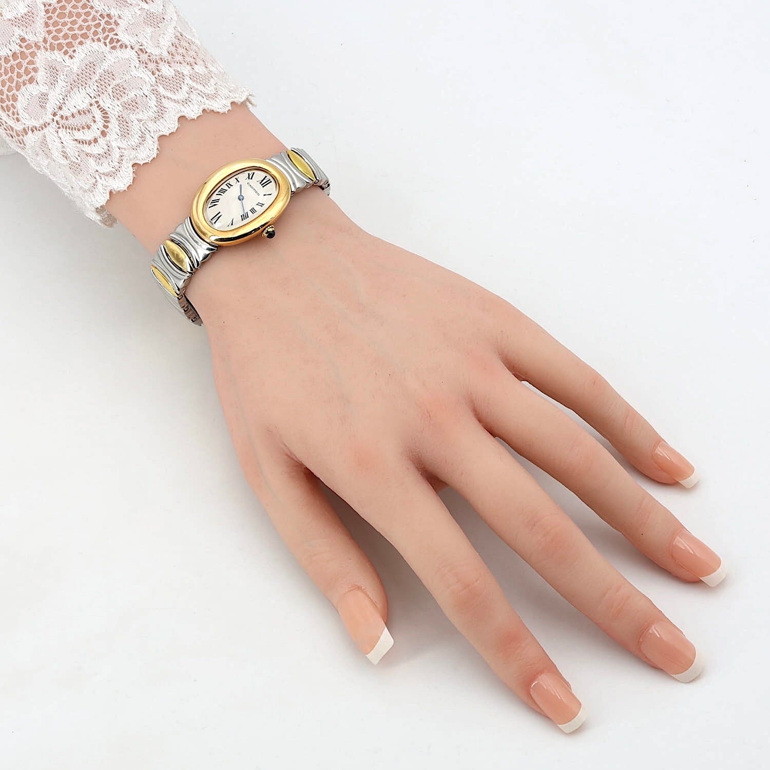 Cartier Baignoire Quartz ladies' wristwatch in 18k yellow gold and steel, full set, on an artificial hand