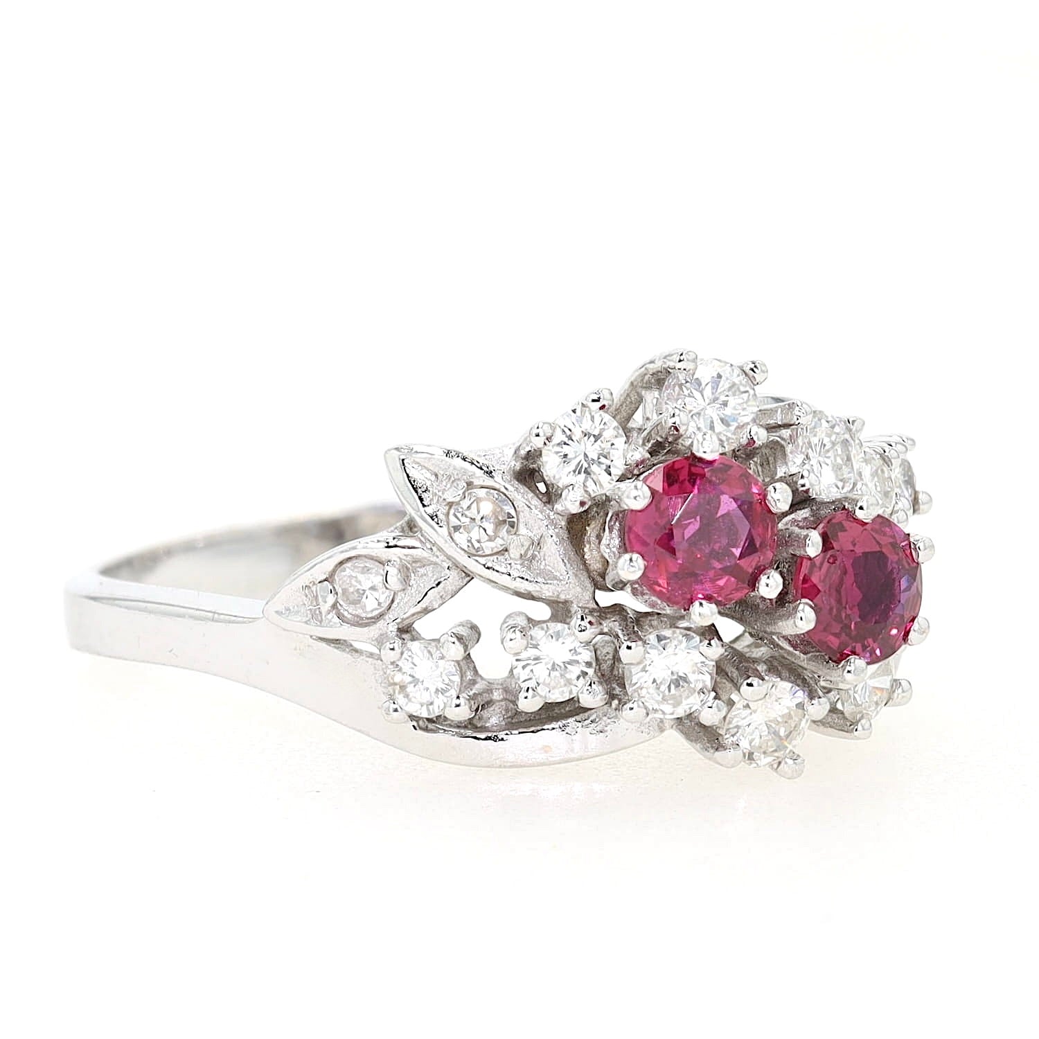 Cluster ring around 1970 in 585 white gold with rubies and diamonds, turned lying on the right