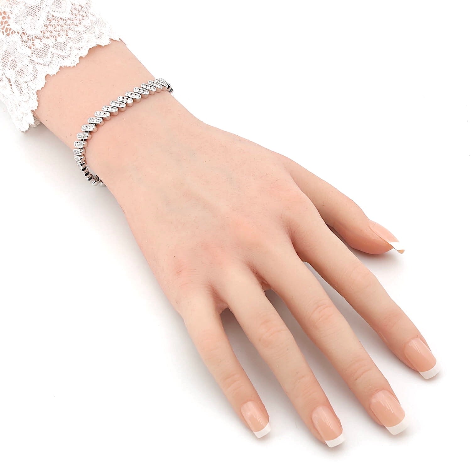 Tennis bracelet in 585 white gold with approx. 2.5 ct Brilliants, on an artificial arm