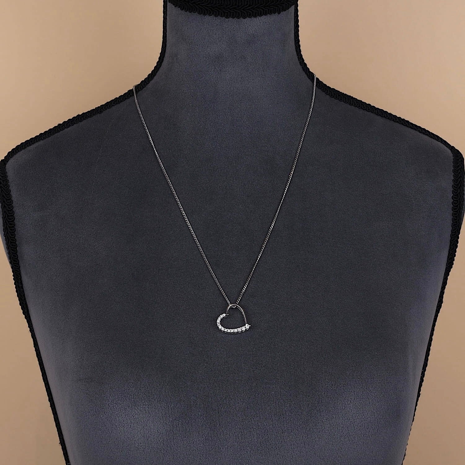 Necklace with a heart pendant from Christ in 585 white gold Brilliants, on a large dark bust