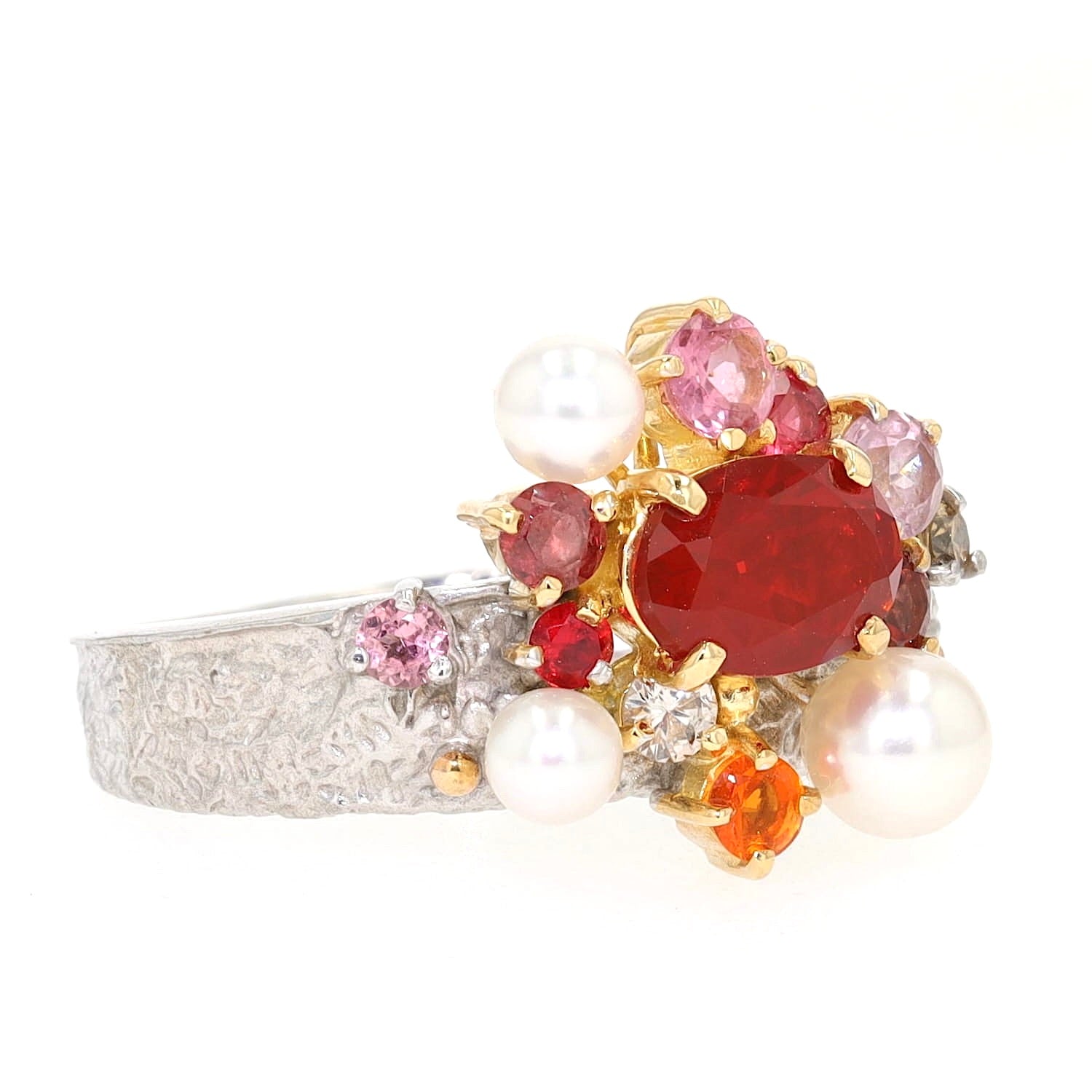 Ring in 750 white gold with fire opals, cultured pearls, Brilliants, Tourmalines and a synthetic spinel, turned lying on the right