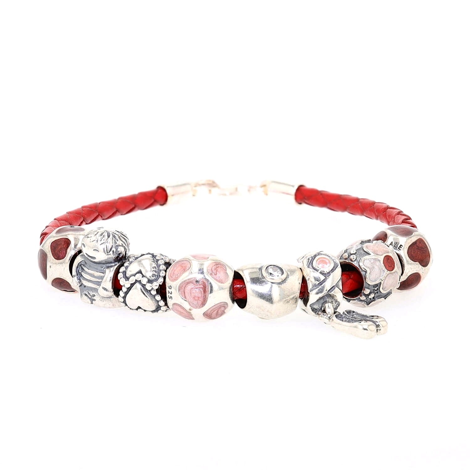 Red leather bracelet with 8 charms from Pandora, lying frontally