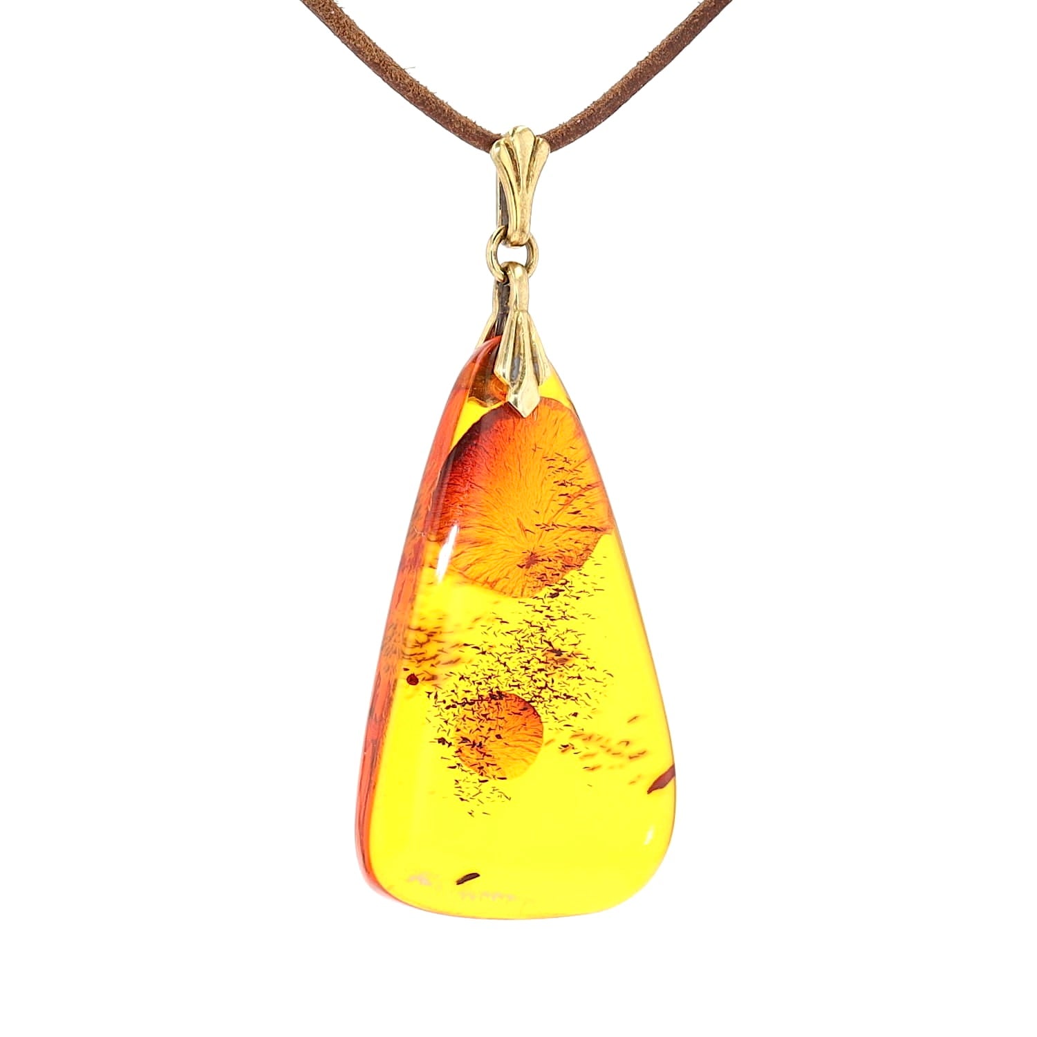 Amber pendant with a setting made of 835 silver, gold-plated, hanging turned to the right