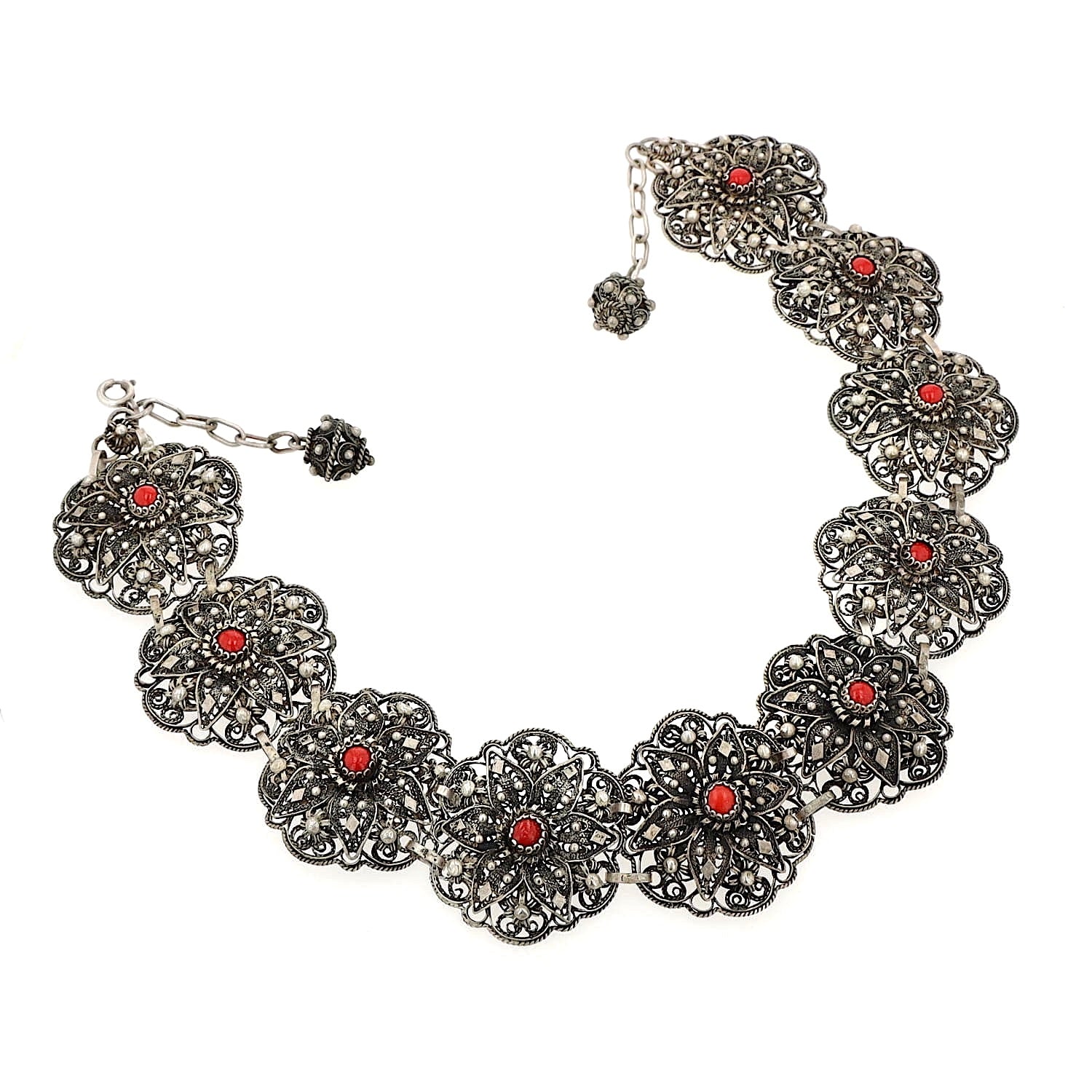 Short traditional jewelry necklace/collar in 925 silver with coral imitations, lying not completely closed, slightly turned to the right