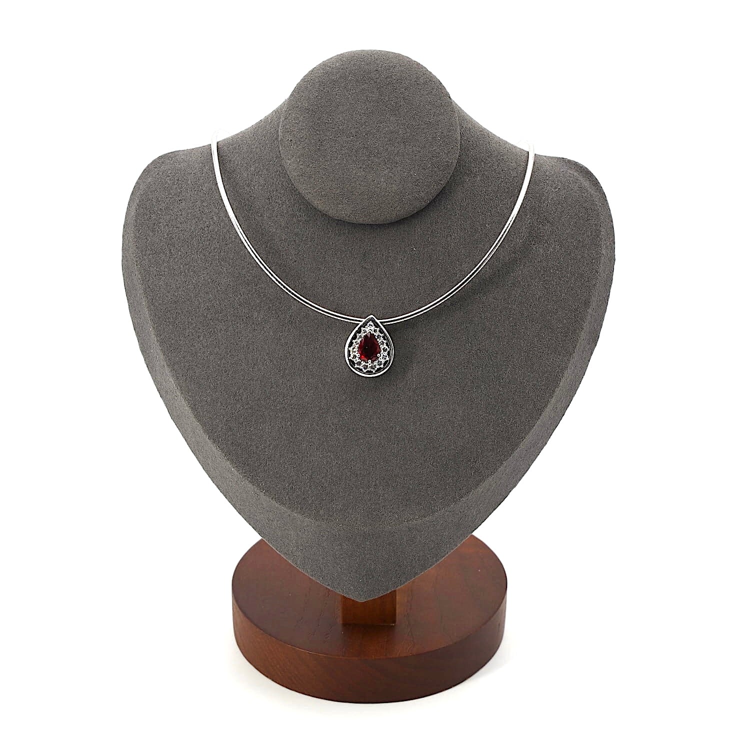 Chain with a pendant in 750 white gold with a ruby and Brilliants, on a dark bust