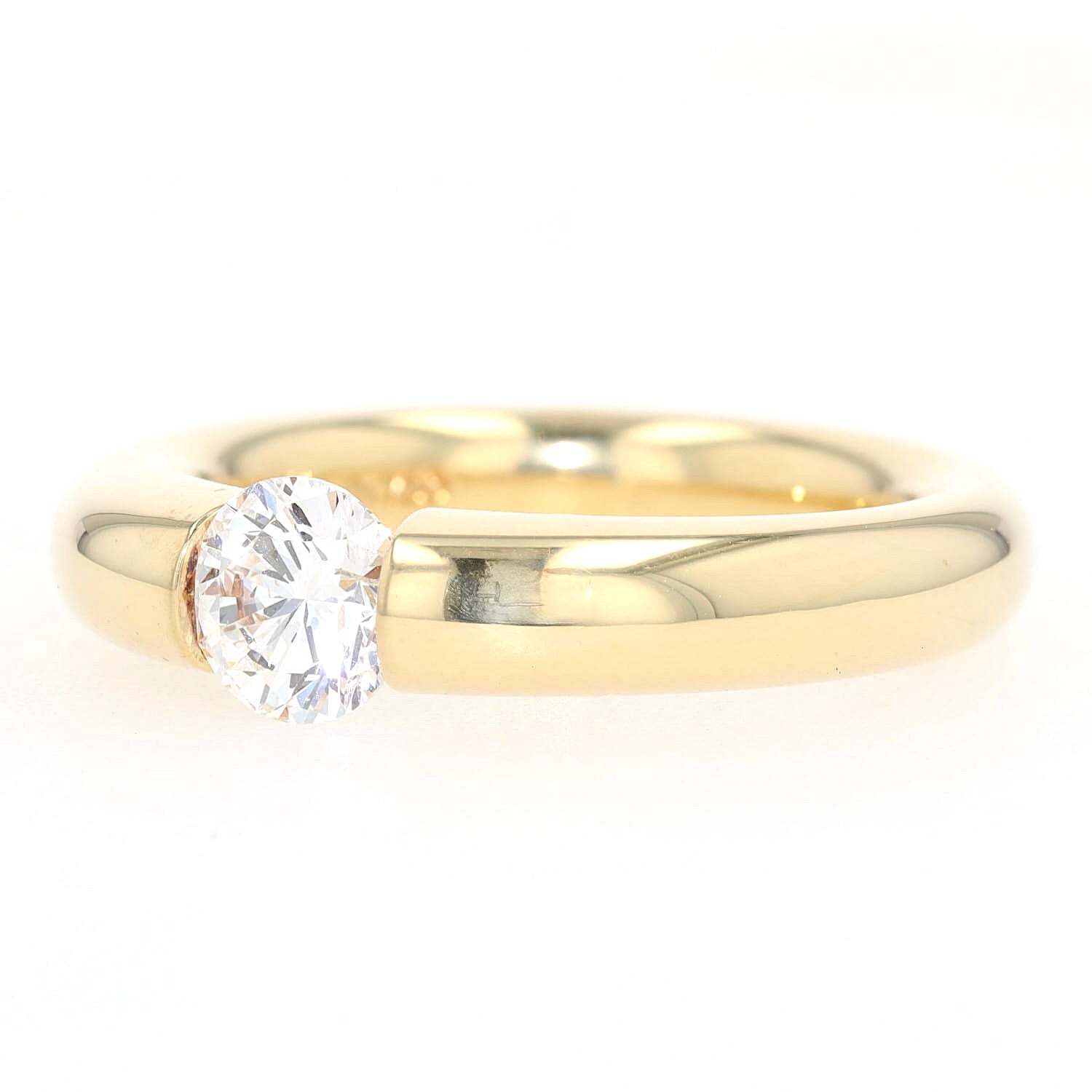 Niessing Spannring in 750er Gelbgold mit einem Brillanten ca. 1,0 ct, liegend links gedreht