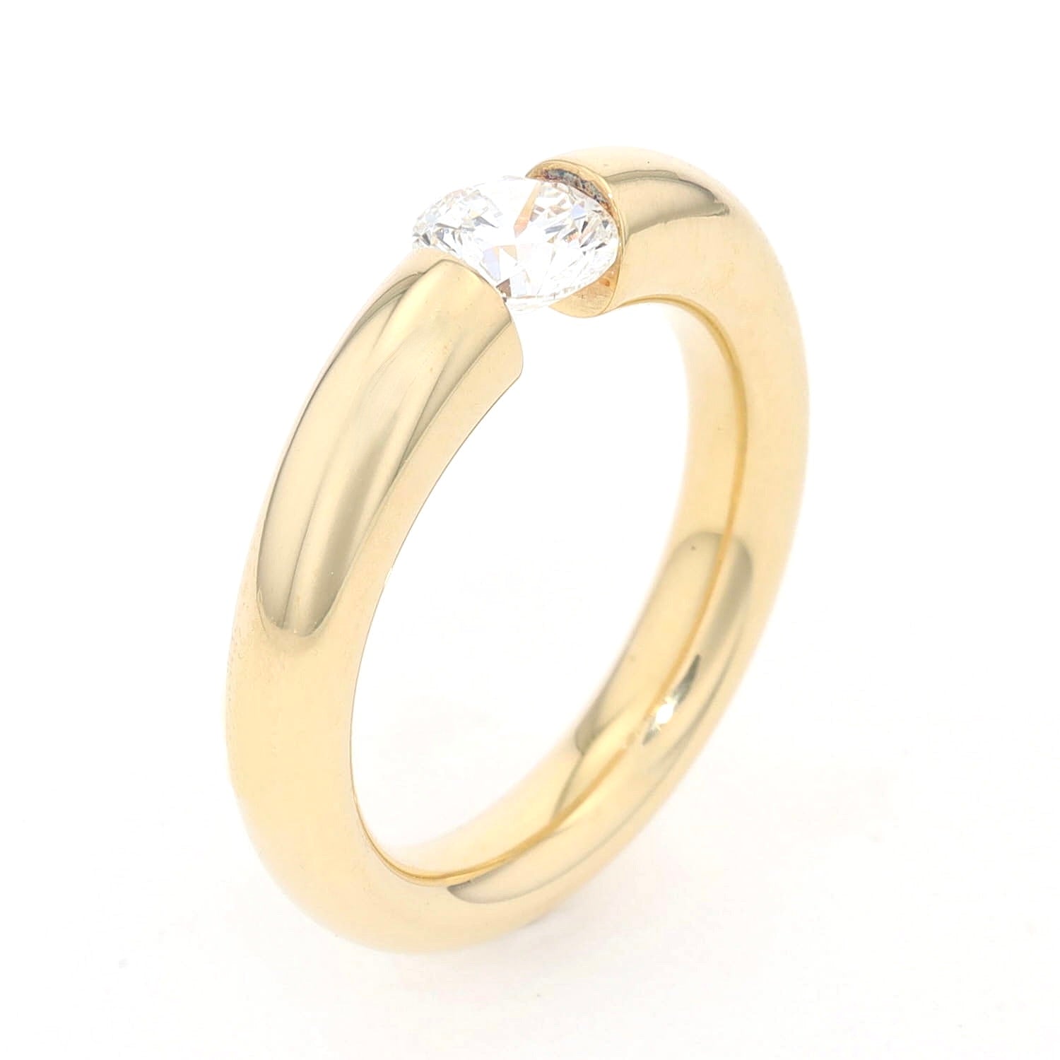 Niessing tension ring in 750 yellow gold with a brilliant approx. 1.0 ct, standing