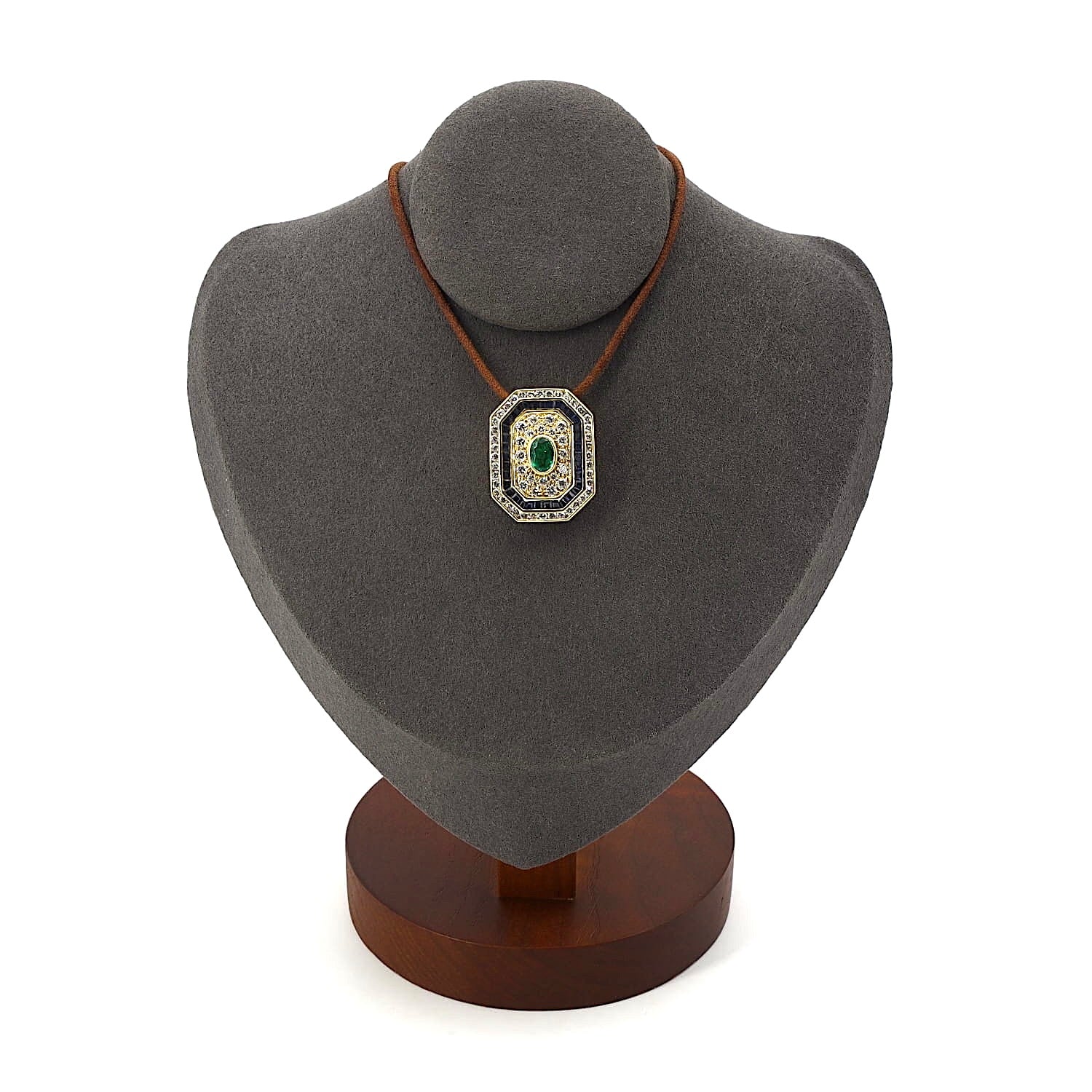 Pendant in 750 yellow gold Brilliants, blue sapphires and an emerald, on a dark bust