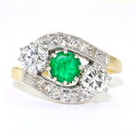 Ring in 585 gold bicolor with an emerald and diamonds and brilliants