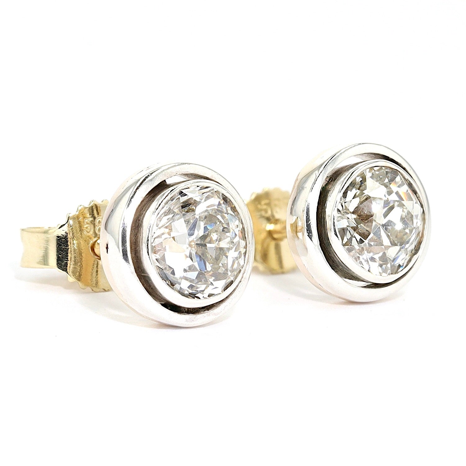 Circa 1900, solitaire stud earrings with diamonds in old european cut, total approx. 1.3 ct in silver and yellow gold