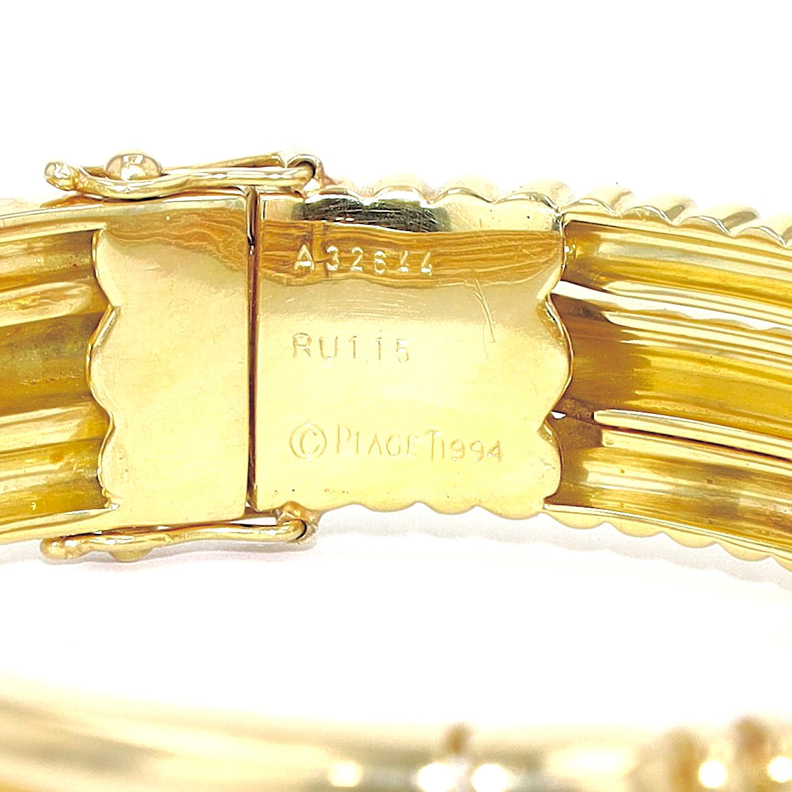 Exclusive Piaget bangle in 750 yellow gold with one Ruby and one brilliants