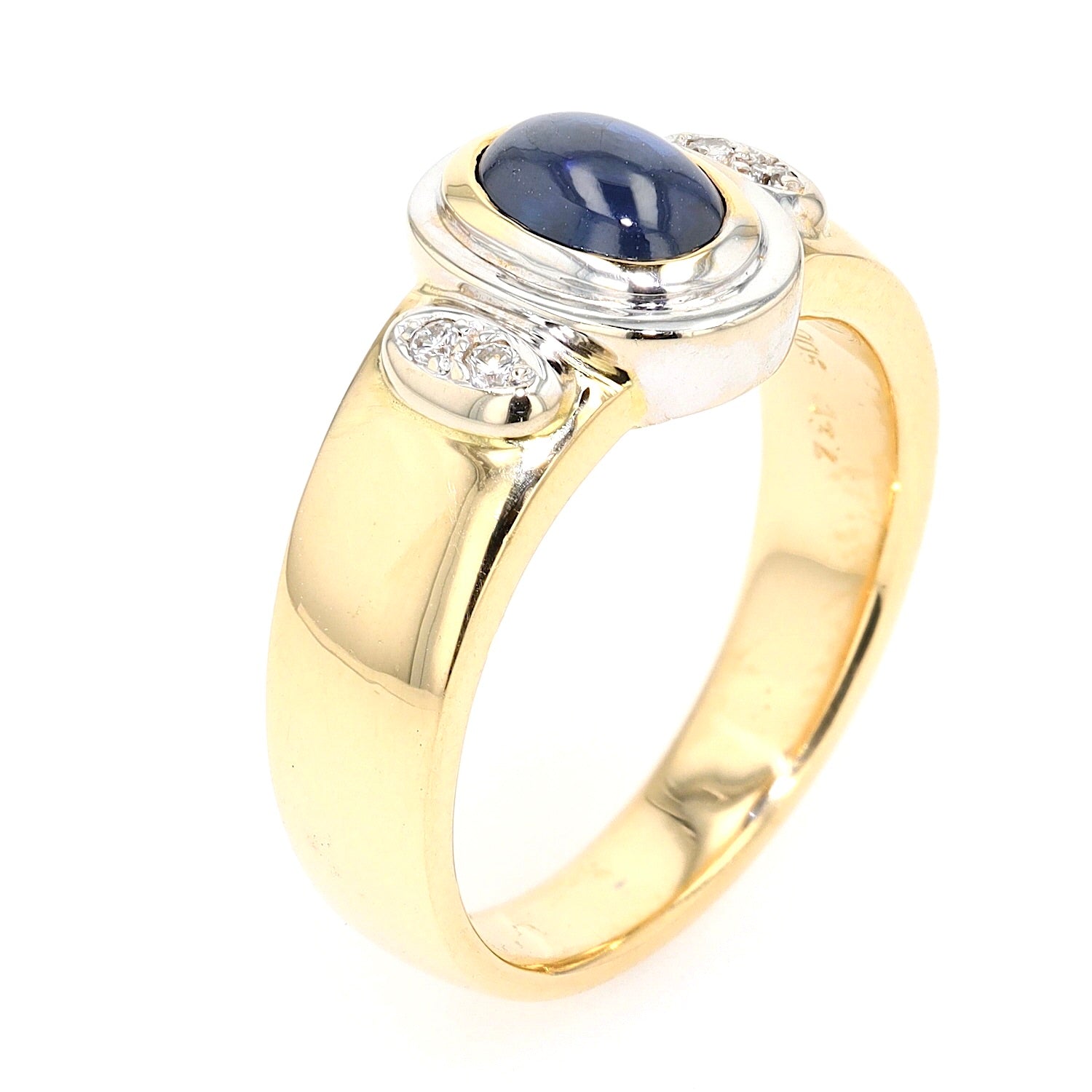   Ring in 750 yellow gold with a blue sapphire cabochon and diamonds