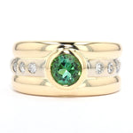 Ring in 585 bicolor gold with brilliants and a tourmaline