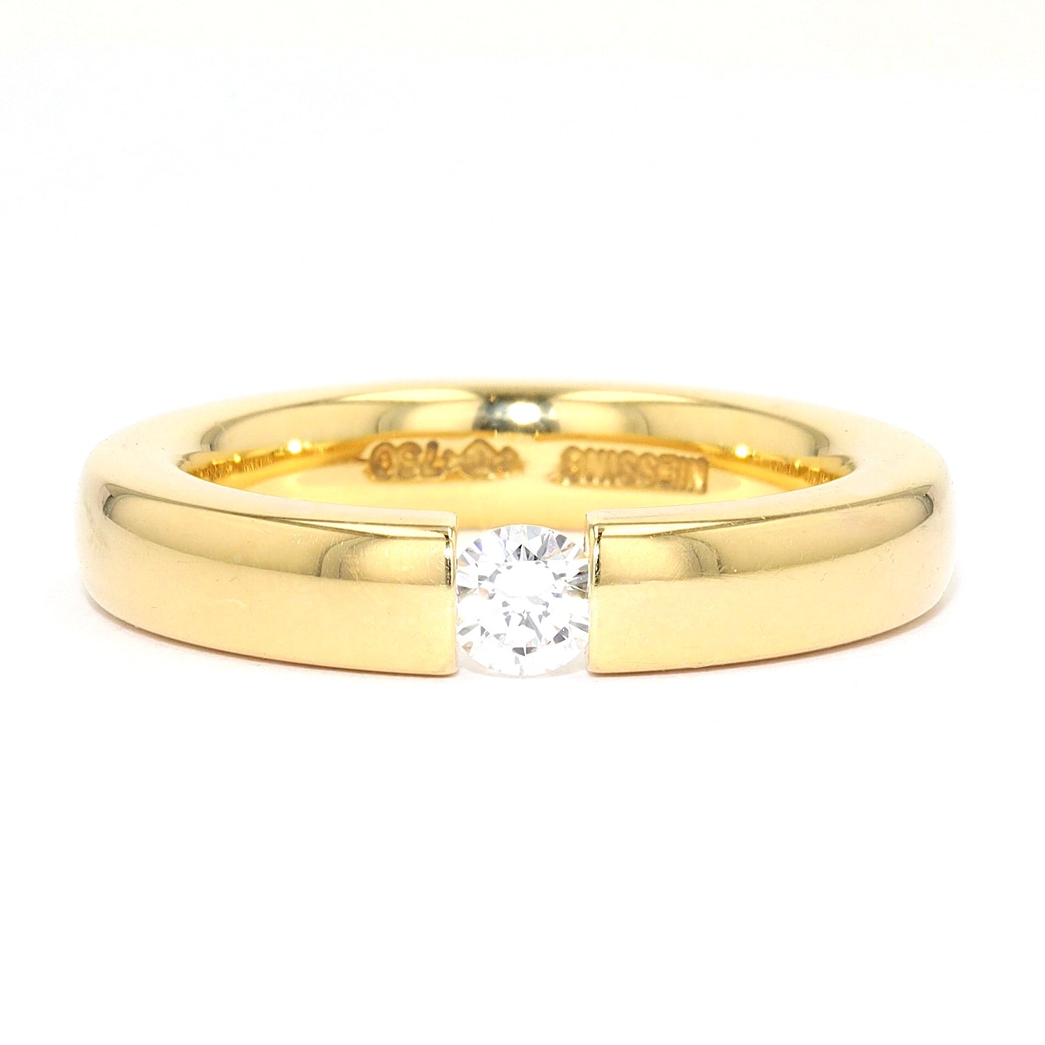 Niessing Spannring in 750er Gelbgold mit einem Brillanten ca. 0,20 ct