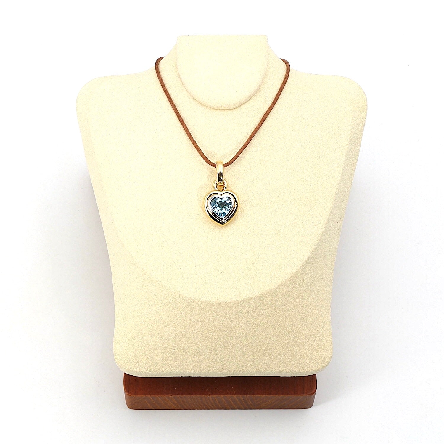 Pendant in 750 bicolor gold with a blue topaz