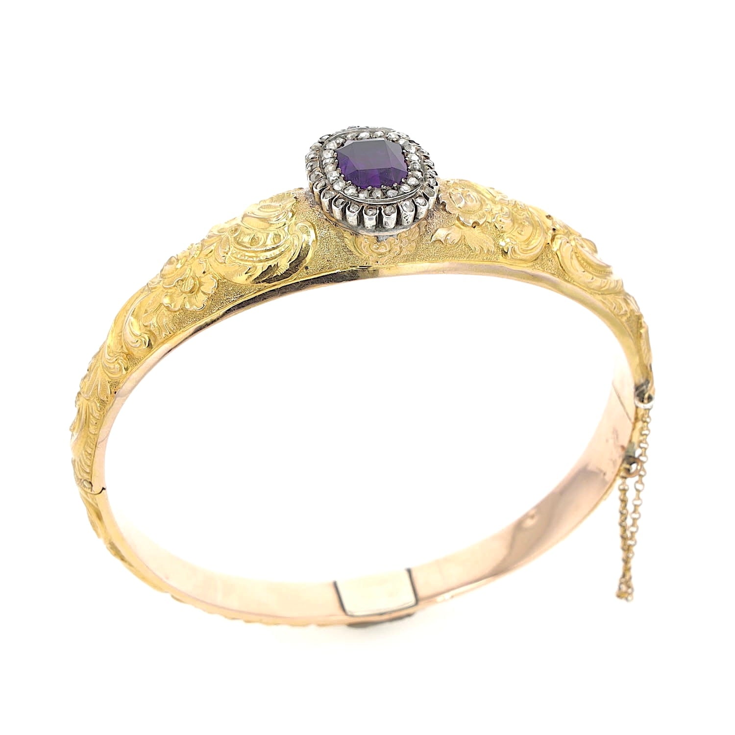 Antique bangle in 750 gold with an amethyst and diamonds, standing at a slight angle