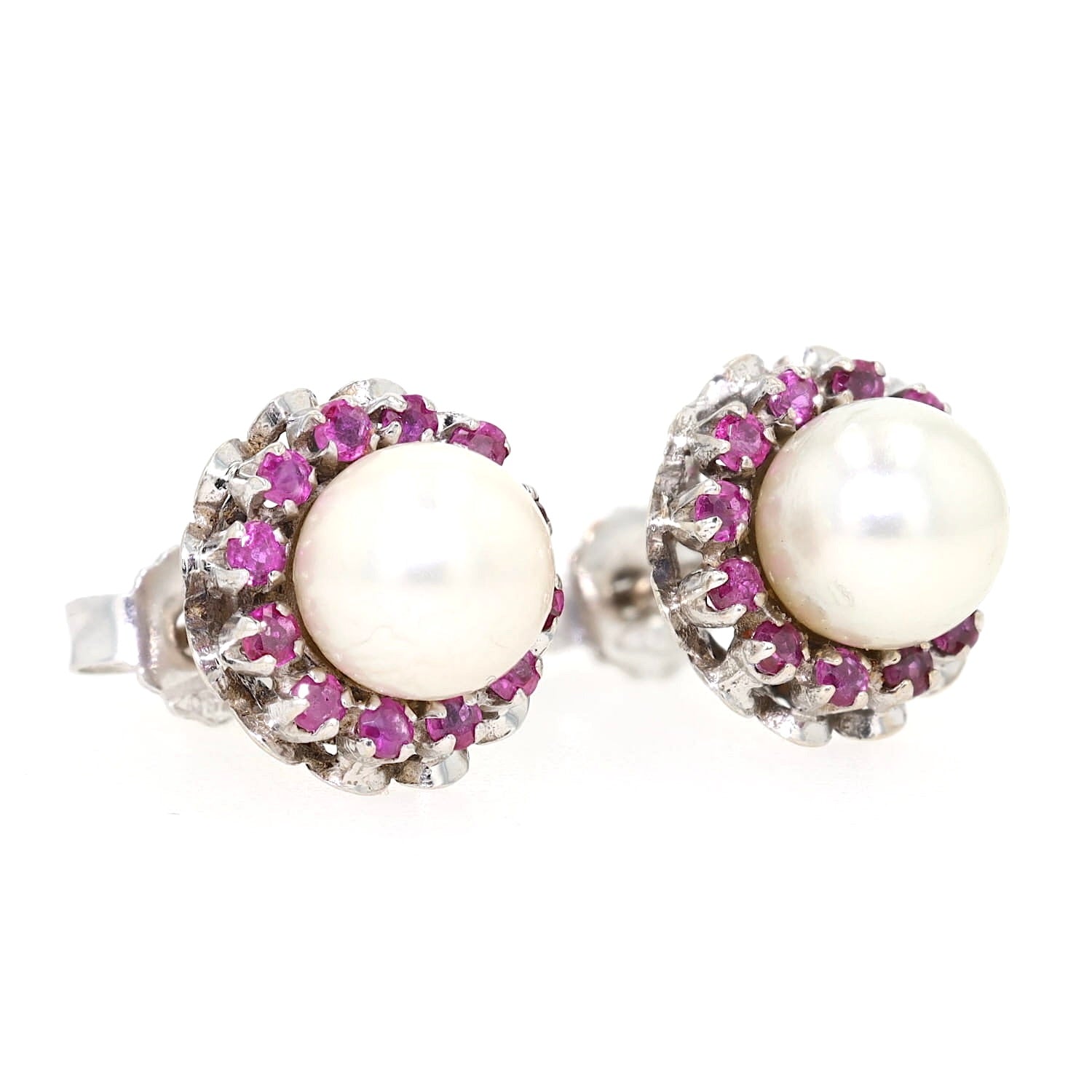 Stud earrings in 750 white gold with one each cultured pearl and rubies, turned lying right