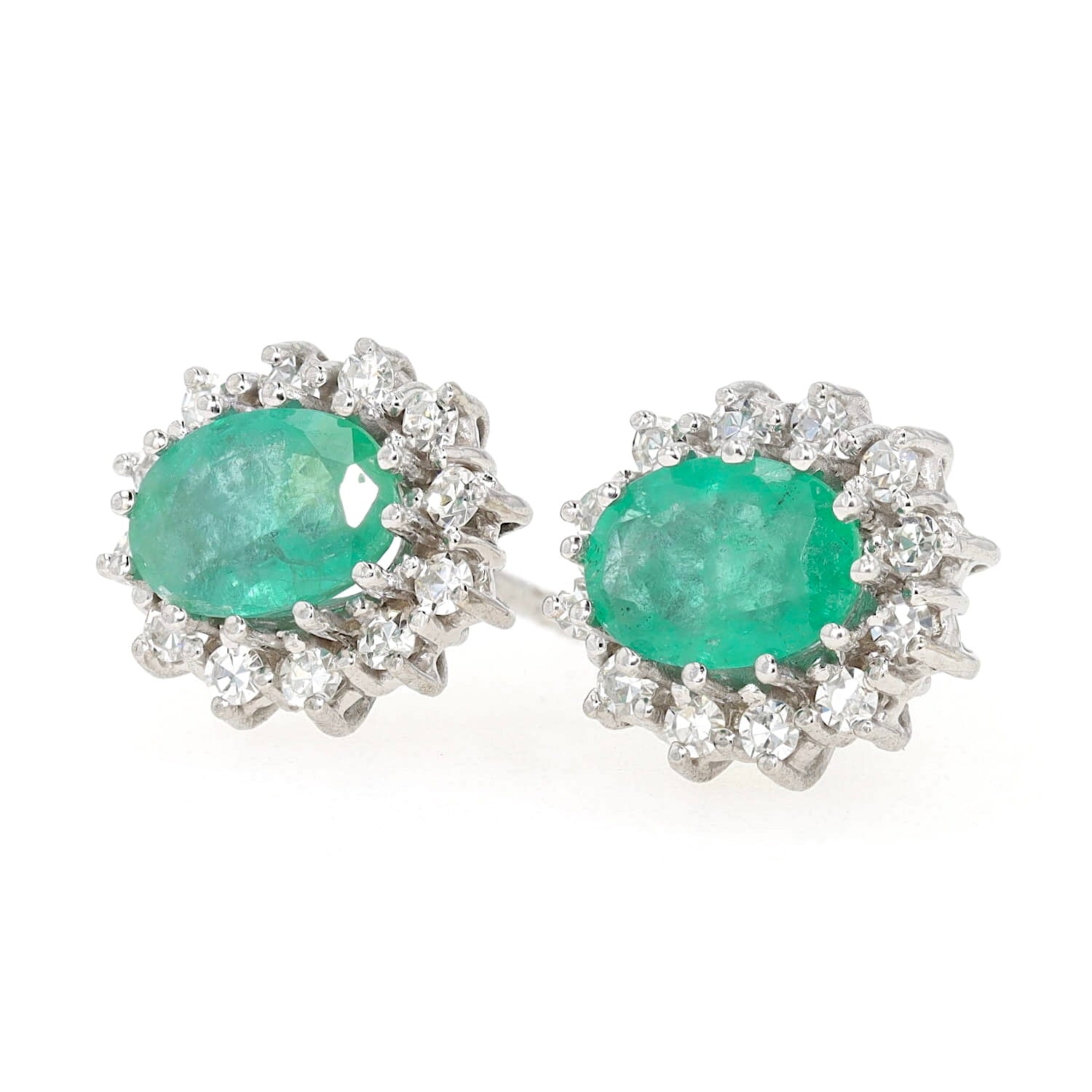 Stud earrings in 585 white gold with emeralds and brilliants