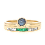 Buchwald ring in 750 yellow gold with diamonds, emeralds and a sapphire cabochon