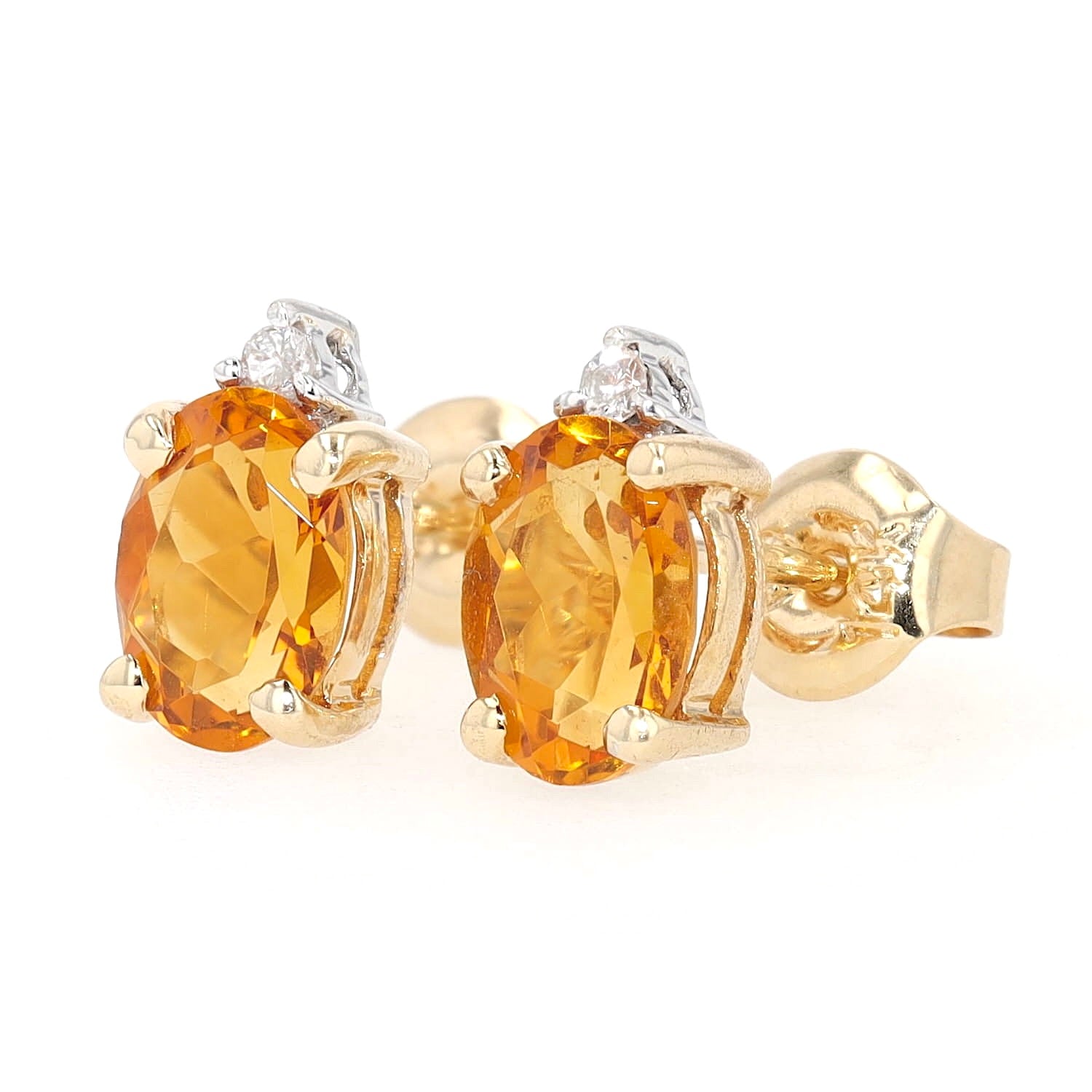 Pair of stud earrings in 585 bicolor gold with a citrine and a brilliants, turned horizontally to the left