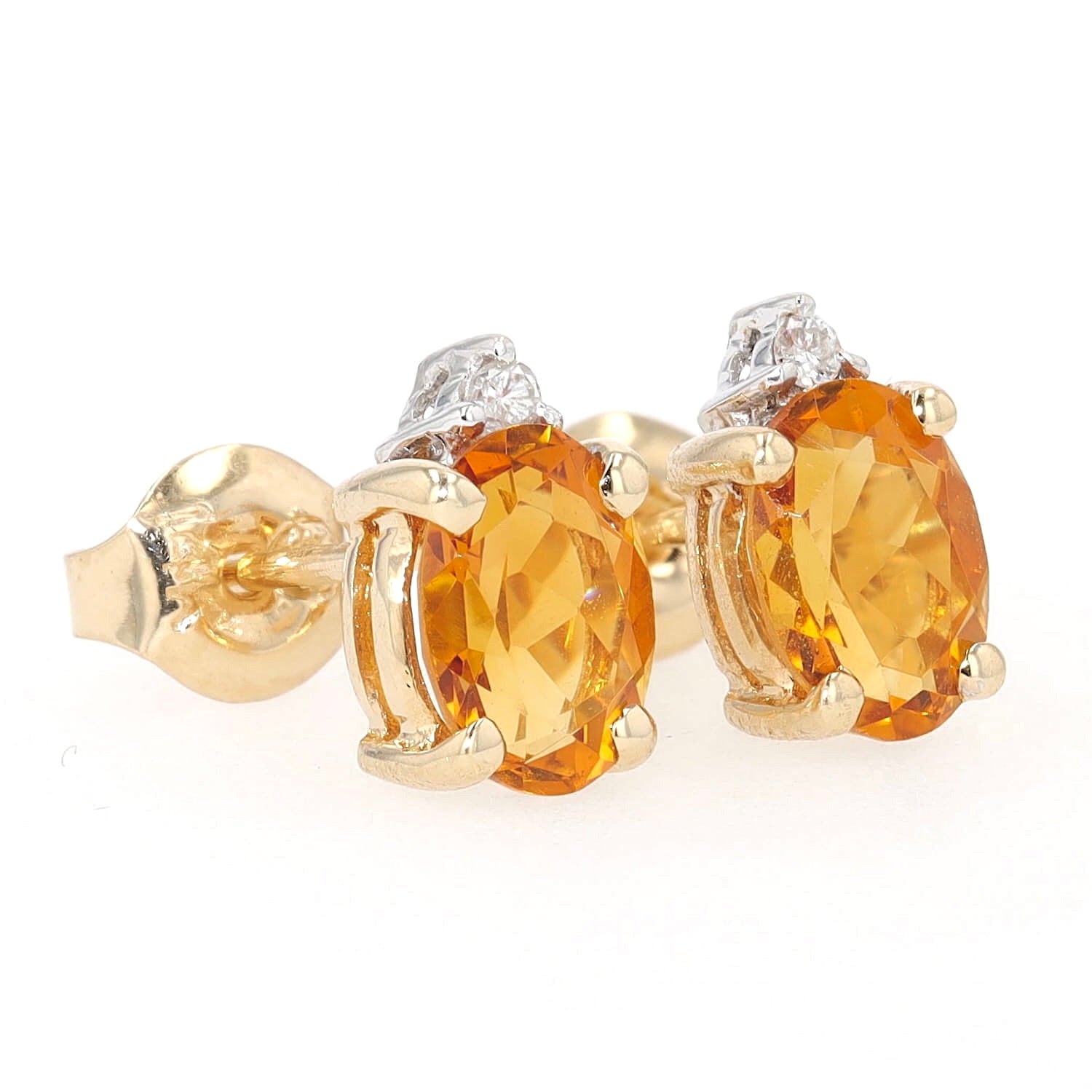 Pair of stud earrings in 585 bicolor gold with a citrine and a brilliants, turned horizontally to the right