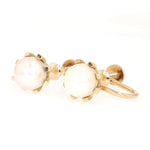 Vintage earrings with ear screws in 585 yellow gold, each with a cultured pearl, turned horizontally to the left