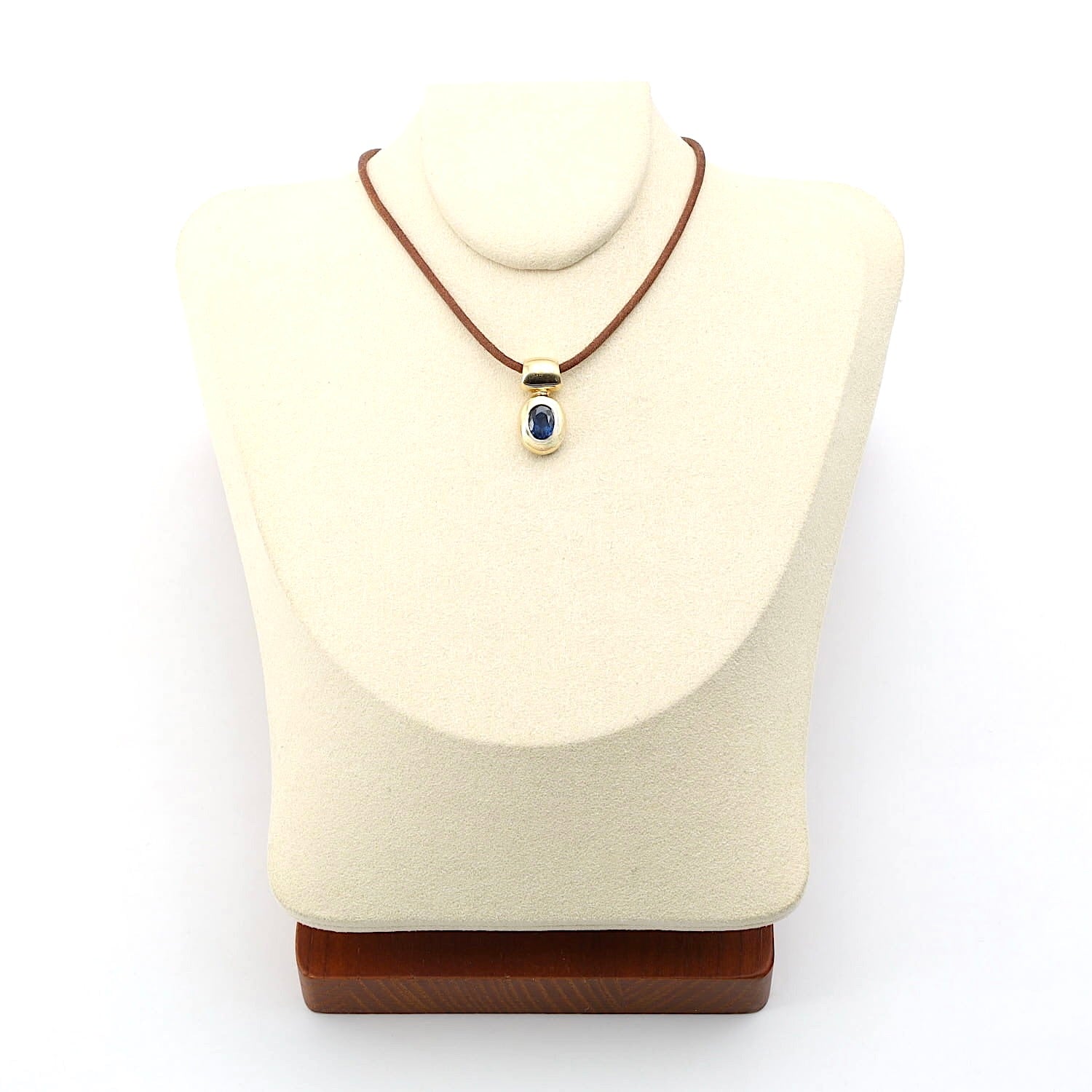 Pendant in 585 yellow gold with a blue sapphire, on the bust