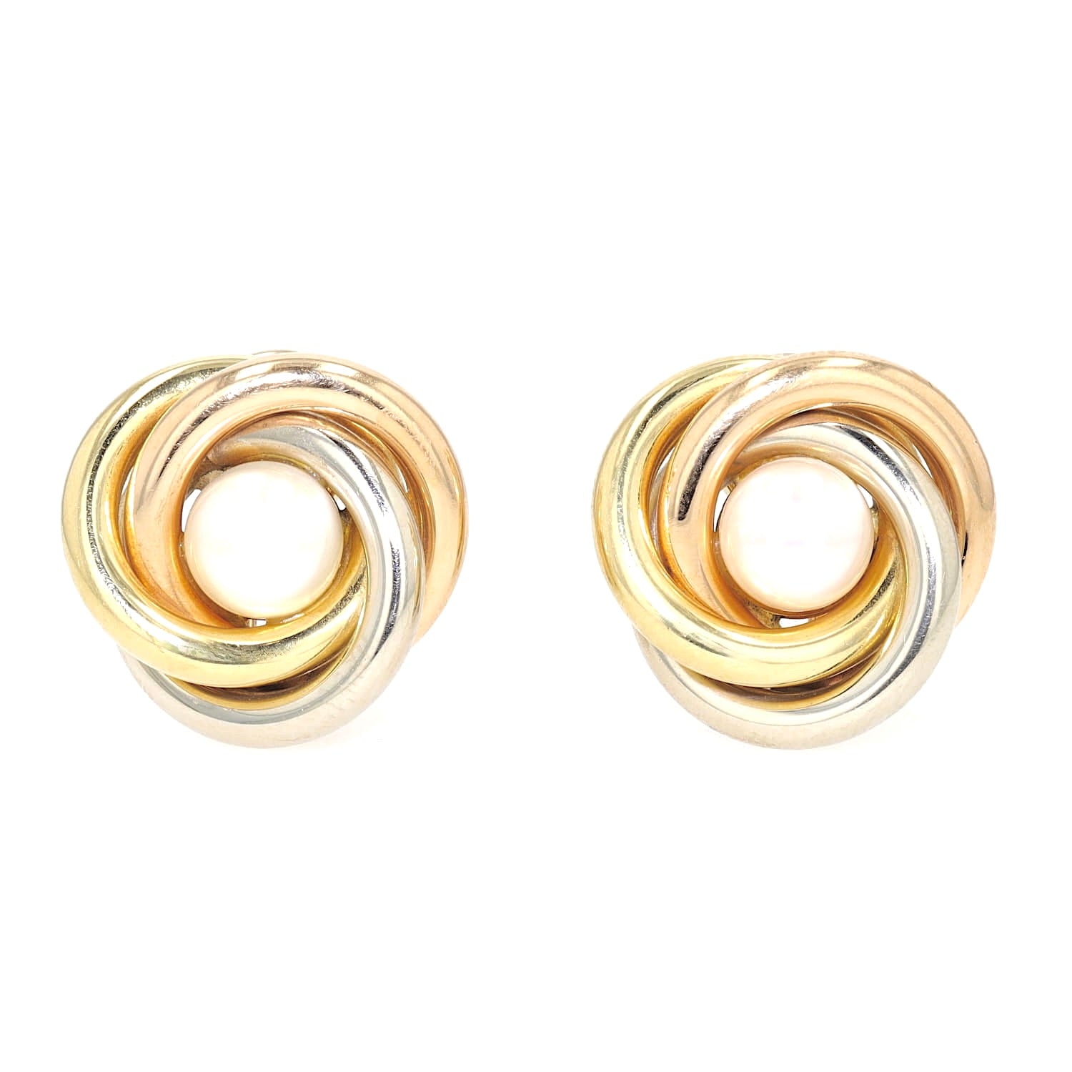 Vintage ear clips in 750 Tricolor gold, each with a cultured pearl, lying frontally