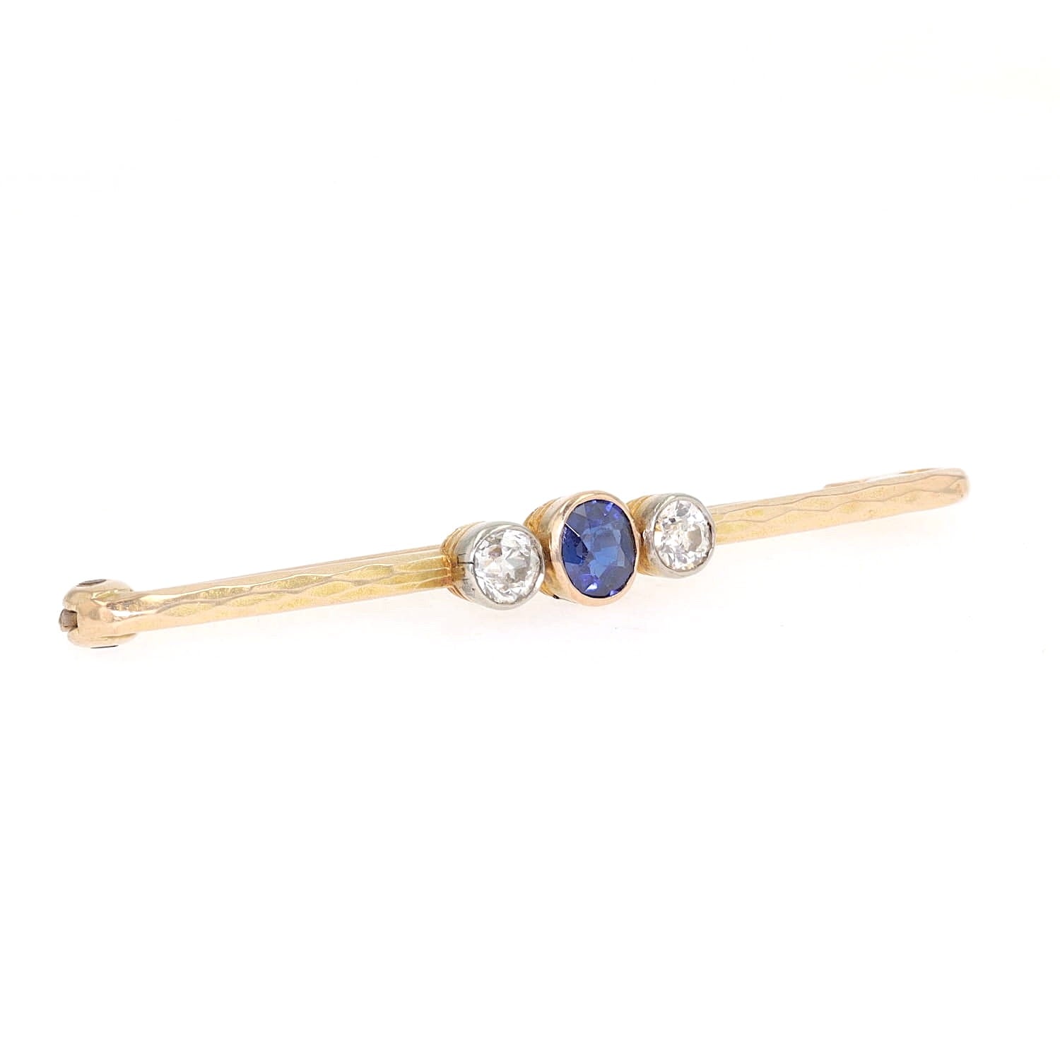 Vintage pin in 585 yellow gold with diamonds and a sapphire, turned horizontally to the right