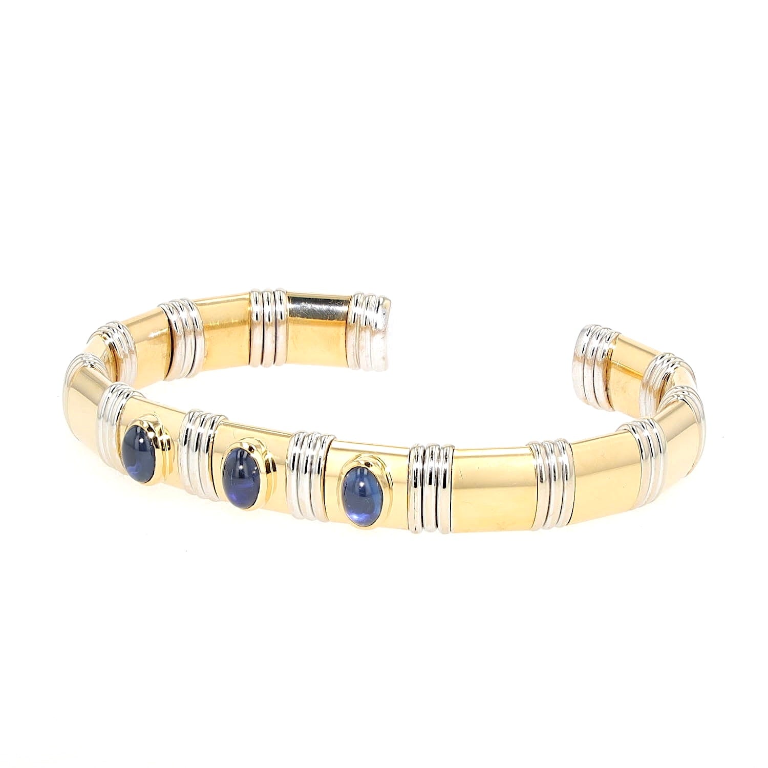 Bangle in 750 yellow and white gold with sapphire cabochons, turned horizontally to the left