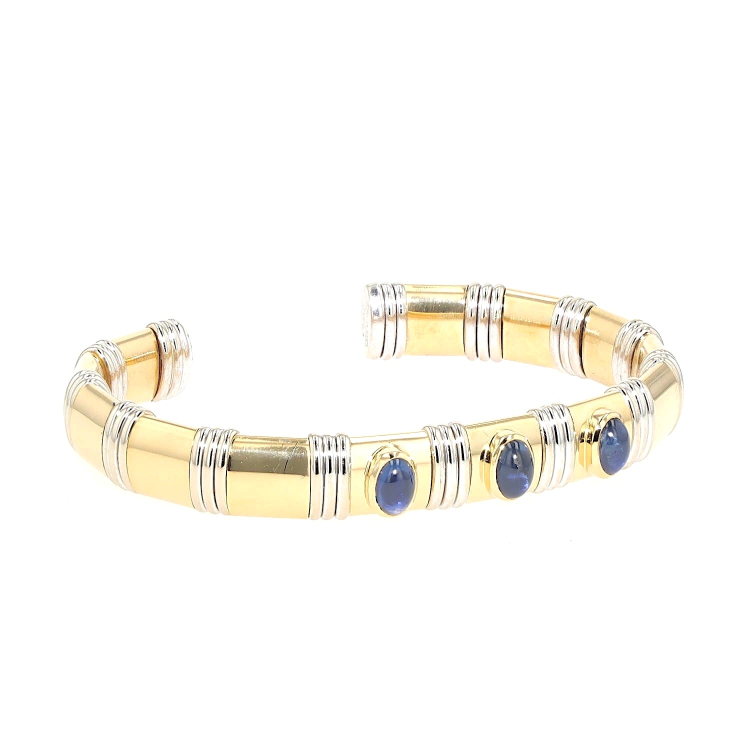 Bangle in 750 yellow and white gold with sapphire cabochons, turned horizontally to the right